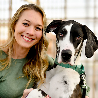 Dr. Lackovic with her dog smiling